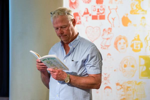  Installation view( A man reading Art by Post booklet) : Art by Post: Of Home and Hope, Southbank Centre, 2021. Photography: Thierry Bal