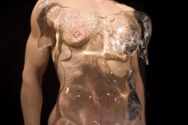 A male torso covered in a case of ice