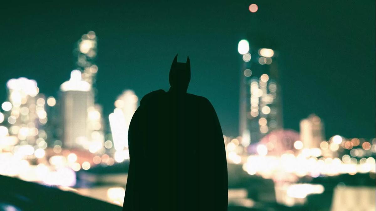 Batman silhoutte against a night-time city scape