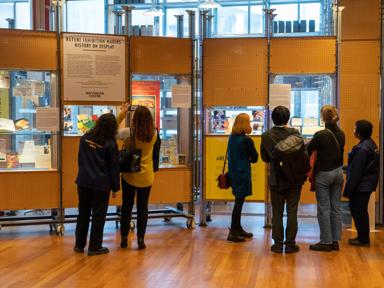 People viewing the archive display at the Future Exhibition Makers on the Open Foyer Policy