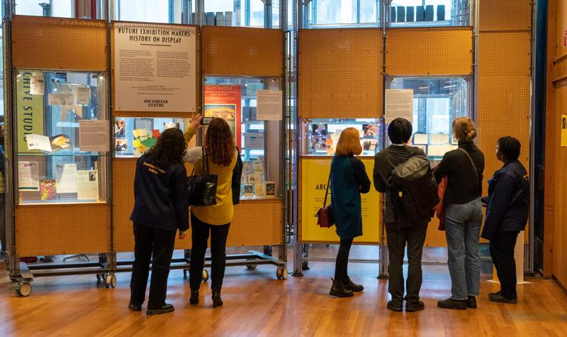 People viewing the archive display at the Future Exhibition Makers on the Open Foyer Policy