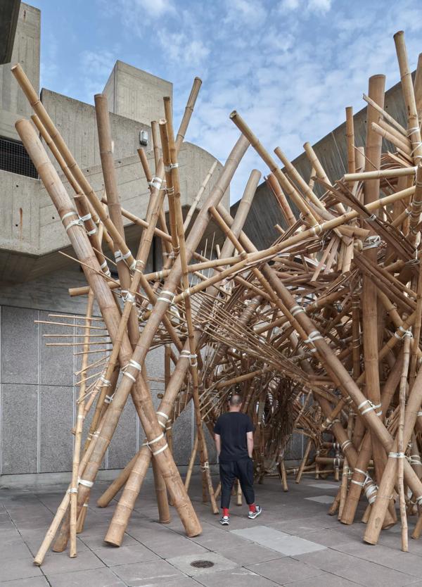 Bamboo structure with a person walking through
