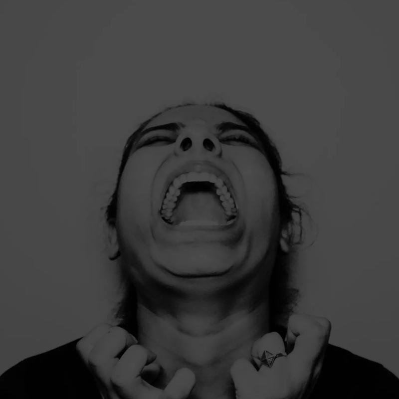 A black and white image of a woman screaming