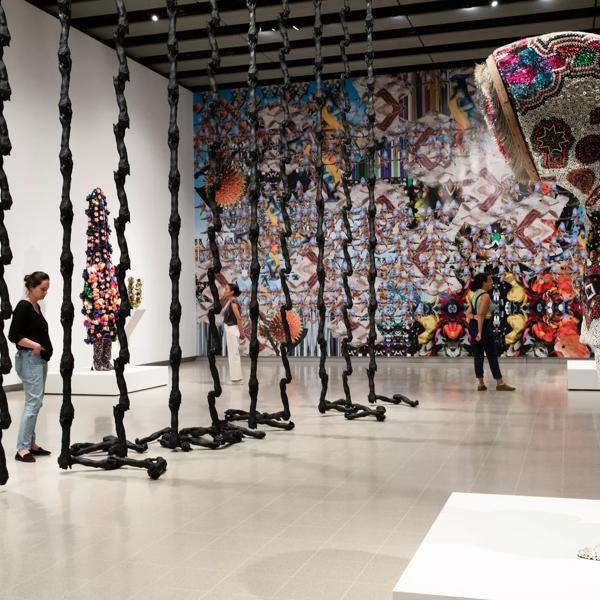 Audience looking at the installation view of Nick Cave works, In the Black Fantastic at Hayward Gallery