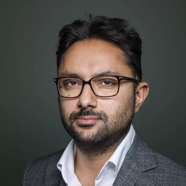 Author Sathnam Sanghera wears a grey jacket and white shirt