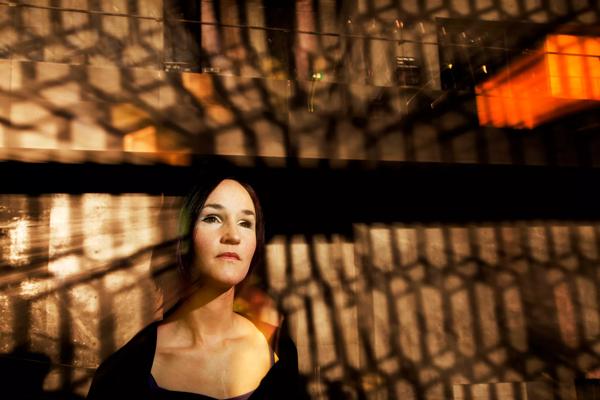 Anna Thorsvaldottir in front of reflected lights