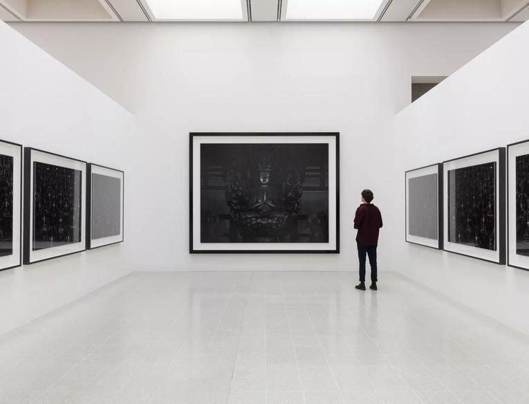 A person looks at Hiroshi Sugimoto, Sea of Buddha installed in the Hayward Gallery.