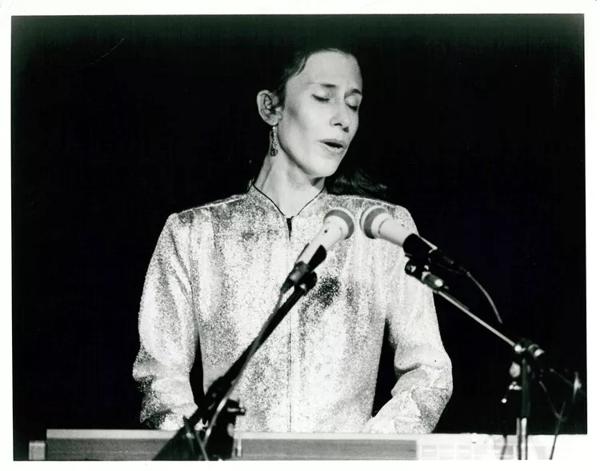 Meredith Monk plays the keyboard on stage