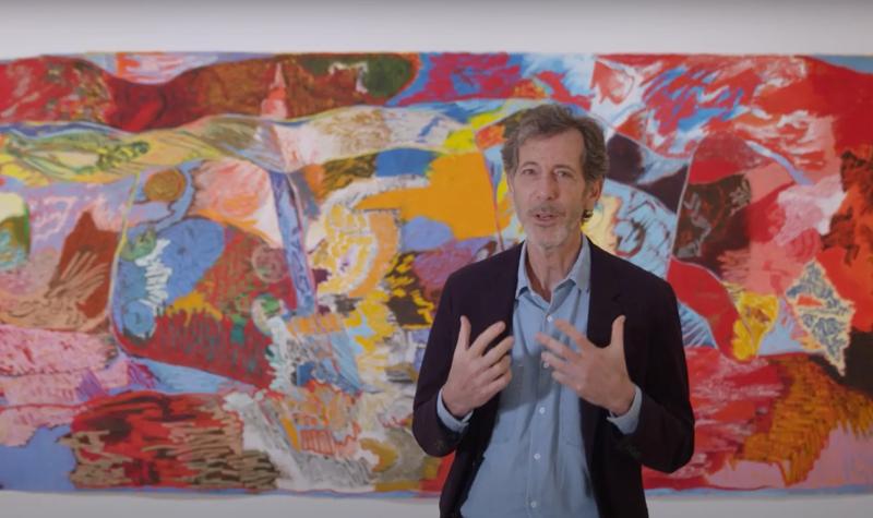 Hayward Gallery Director Ralph Rugoff stands in front of the artwork lick your teeth, they so clutch by Rachel Jones in Hayward Gallery’s exhibition, Mixing It Up: Painting Today