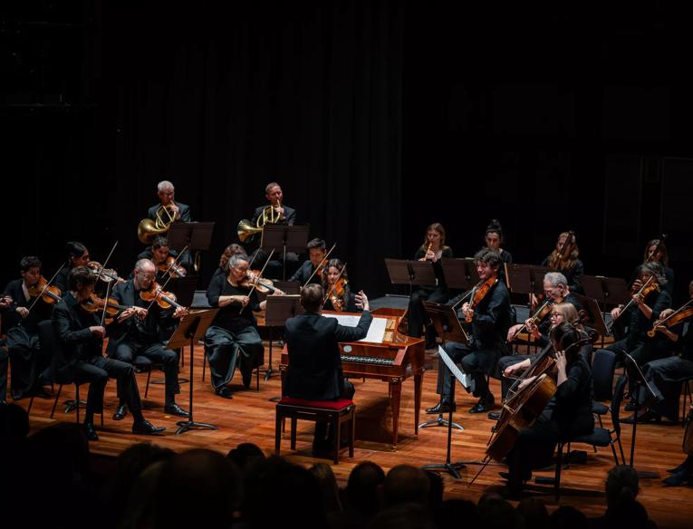 Orchestra of the Age of the Enlightenment perform around a harpsichordist