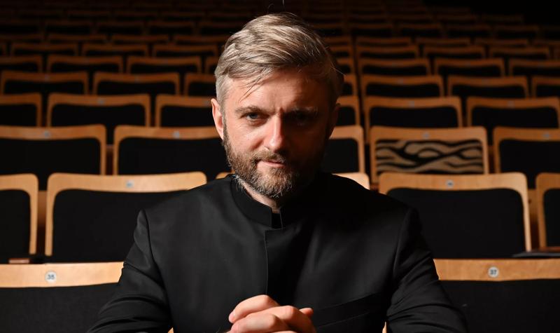 Conductor Kirill Karabits sat in the stalls of an empty venue