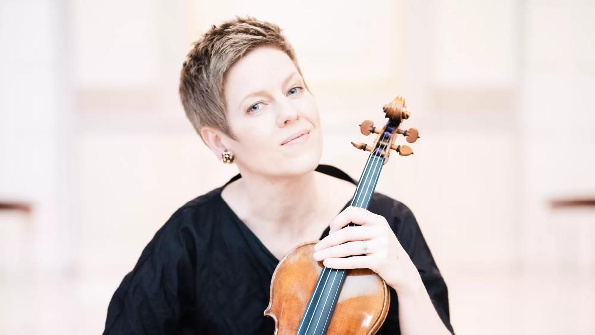 Isabelle Faust holding a violin
