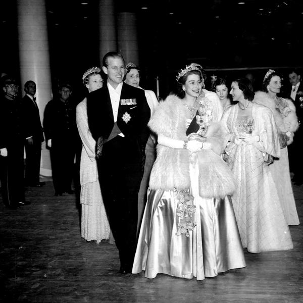  HM Queen Elizabeth II and Prince Philip, the Duke of Edinburgh, wearing formal dress as they attend a concert at Festival Hall, London, May 1951. (Photo by Hulton Archive/Getty Images)
