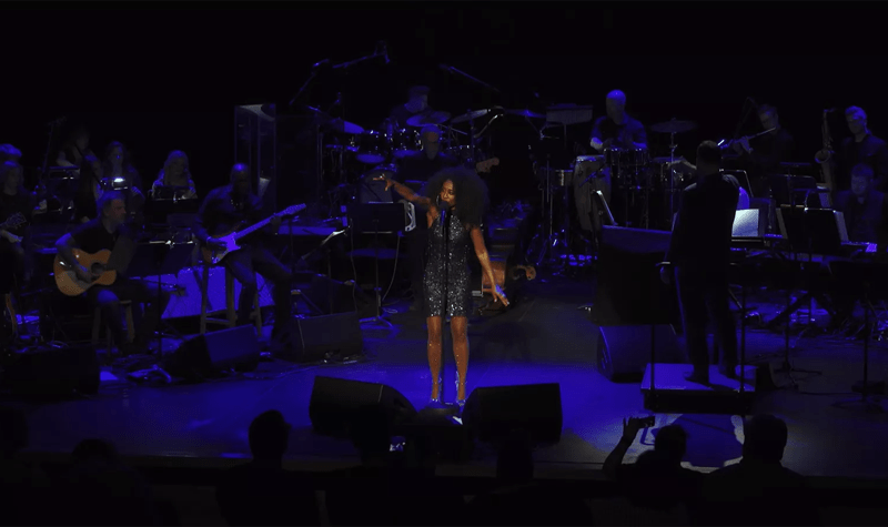 Beverley Knight on stage backed by an orchestra