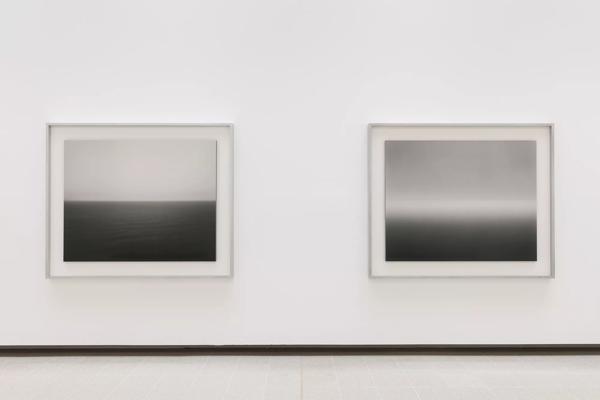 Two of Hiroshi Sugimoto's Seascapes photographs against a white wall