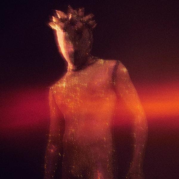 Futuristic portrait of artist Lynks in a full body sparkly body suit with a spikey head.