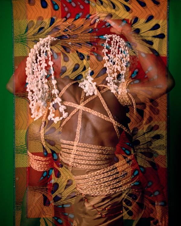 A collage image featuring a black model looking away from the camera, with printed fabric and rope