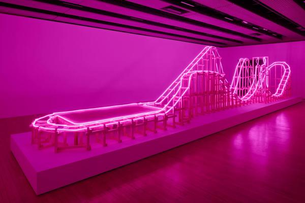 A neon pink rollercoaster structure