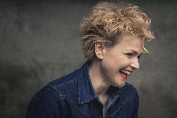 Maxine Peake in a denim shirt and wearing red lipstick