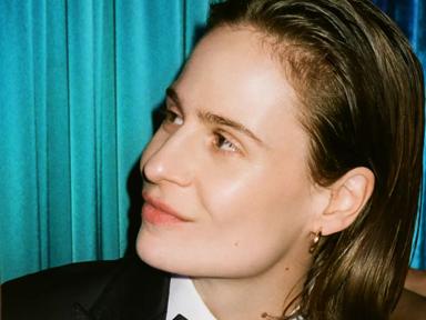 Christine and the Queens in a suit looking to the left