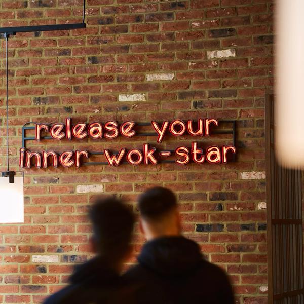 Wagamama Southbank neon sign reading 'Release your inner wok- star'