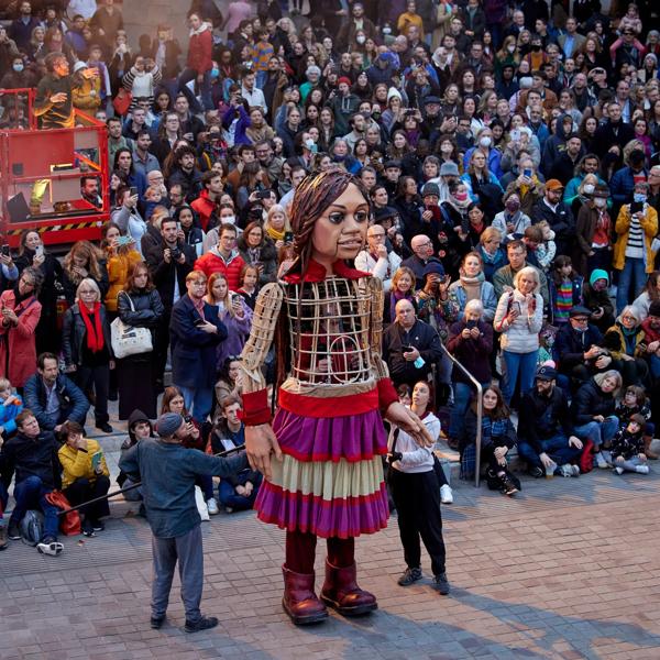 Little Amal in front of an audience