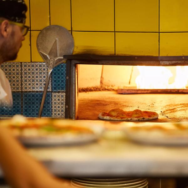 Strada pizza being cooked in the oven