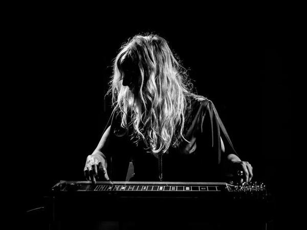 Composer and singer Heather Leigh playing a pedal steel guitar 