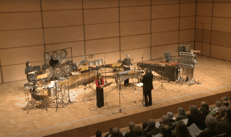 The Divertimento Ensemble, play percussion on stage in a modern concert hall in Milan