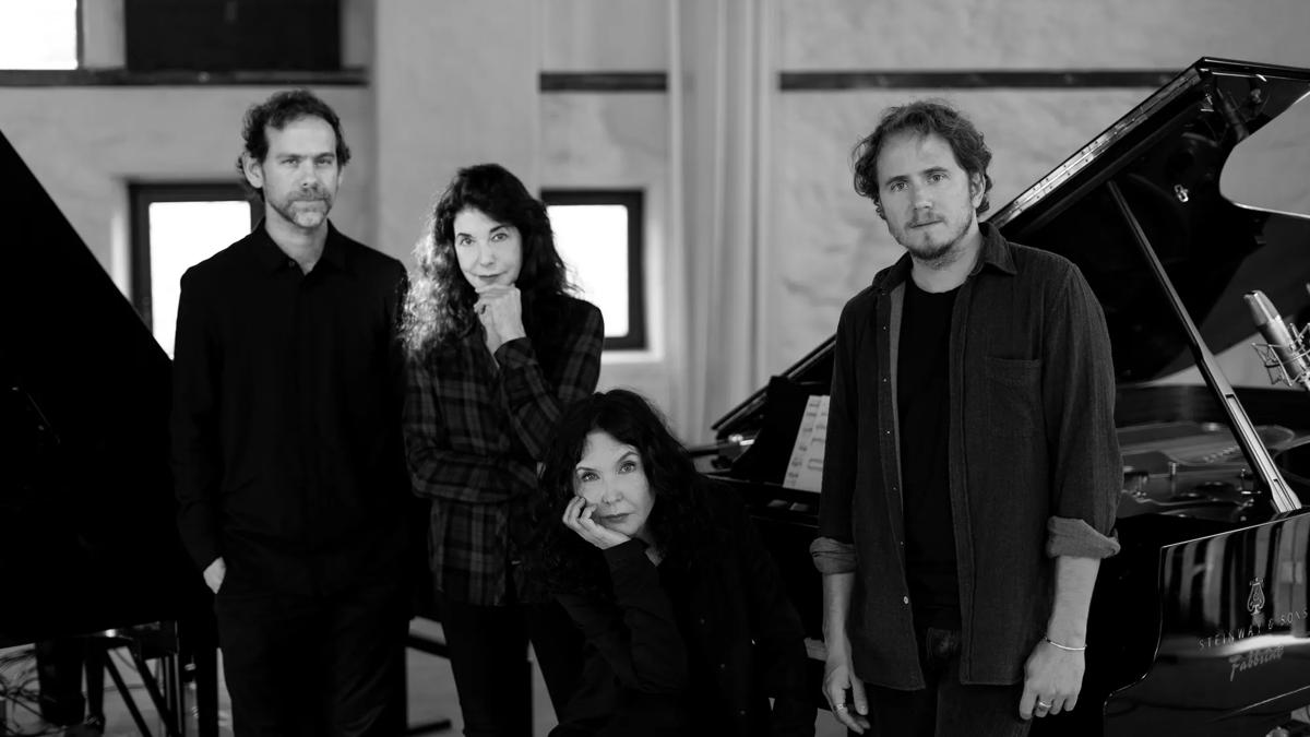Labeque sisters, Bryce Dessner in black and white photo in front of piano.