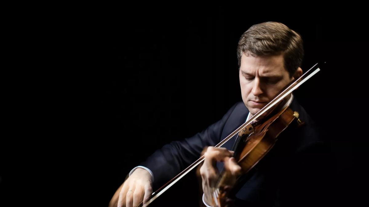 James Ehnes  plays violin on a dark background