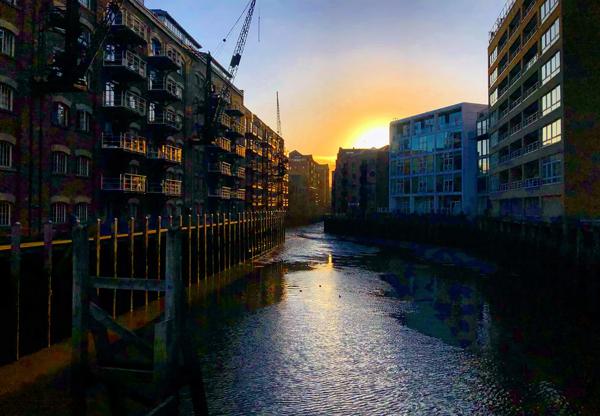 The sun setting behind one of the docks in Bermondsey