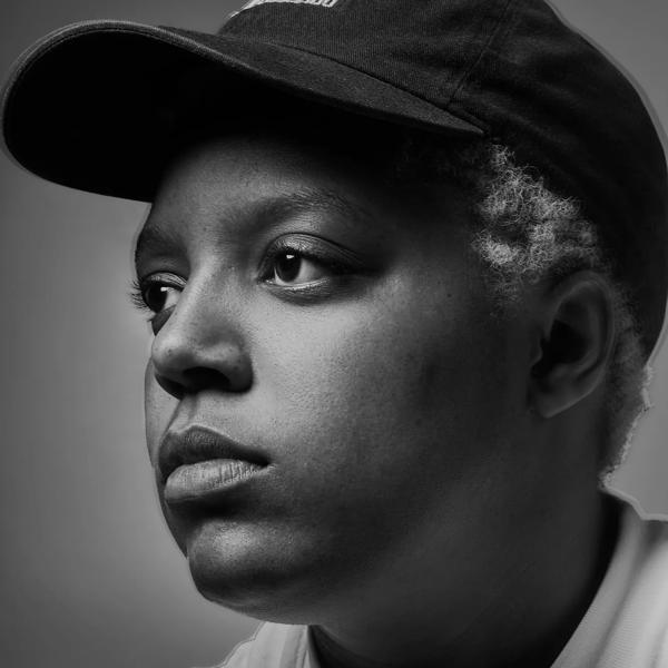 Portrait  of Loraine James wearing a baseball hat