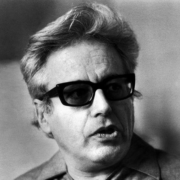 A black and white photo of a man wearing sunglasses