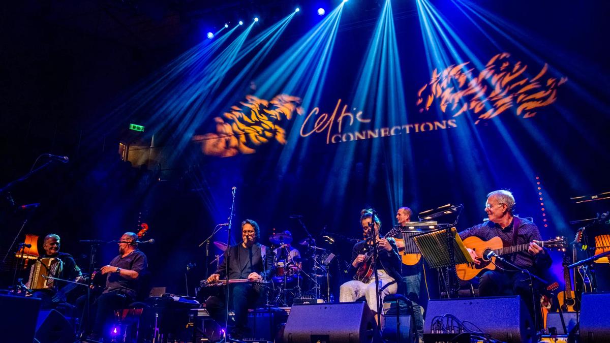 Transatlantic Session performance at The Glasgow Royal Concert Hall. In the background the title Celtic Connections is written on the wall